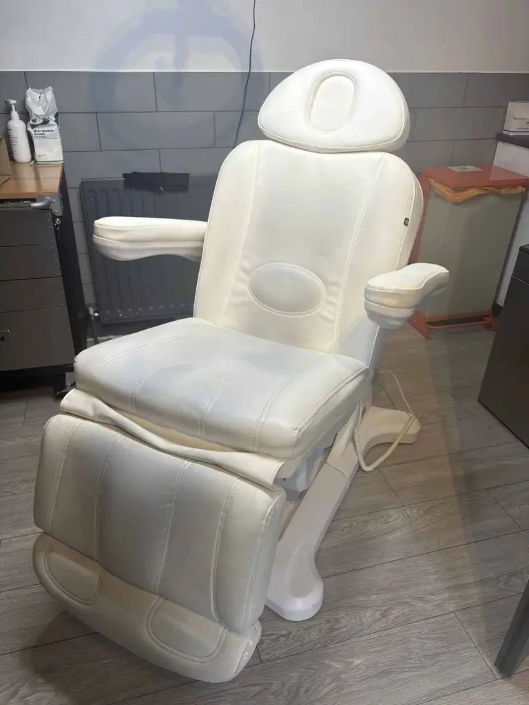 a dirty leather chair in a salon